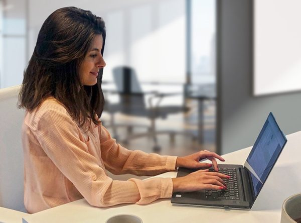 Estelle Mekari working on laptop