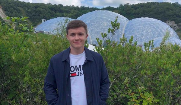 Joseph Lynch with dome structures in the background.