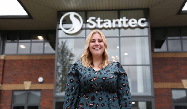 Sarah McGrath standing in front of the Stantec office.