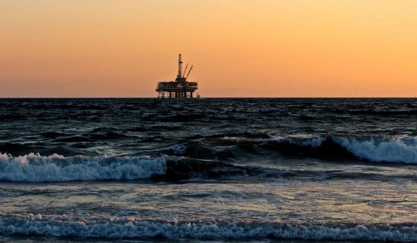 Offshore drilling rig at sunset