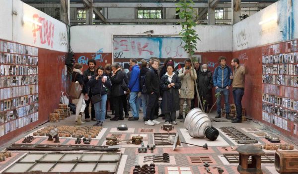 Visitors observing the installation.