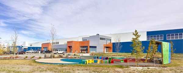 Exterior of the building with a playground