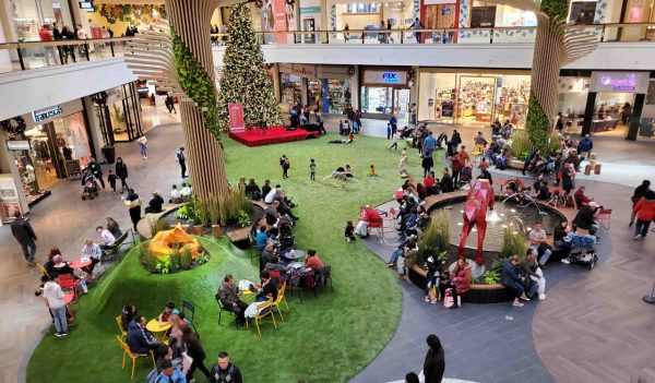 Aerial view of gathering space with seating and landscape in the mall