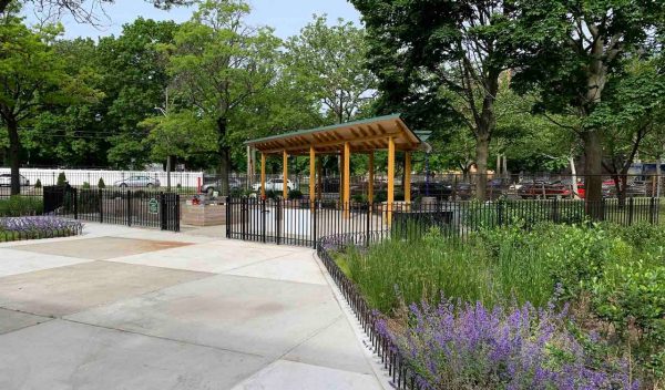 Paved walkway with plantings on each side