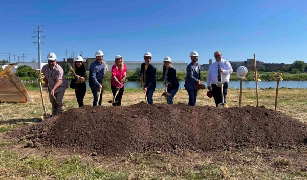 People with shovels groundbreaking