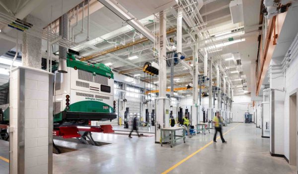 Maintenance garage with equipment and a bus on a hoist