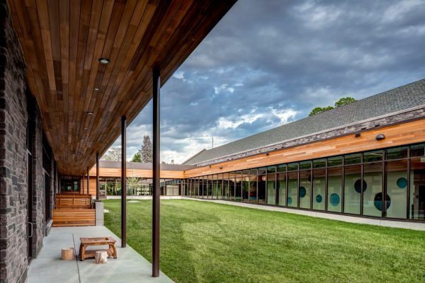 Exterior courtyard with sidewalk and grass area in the middle