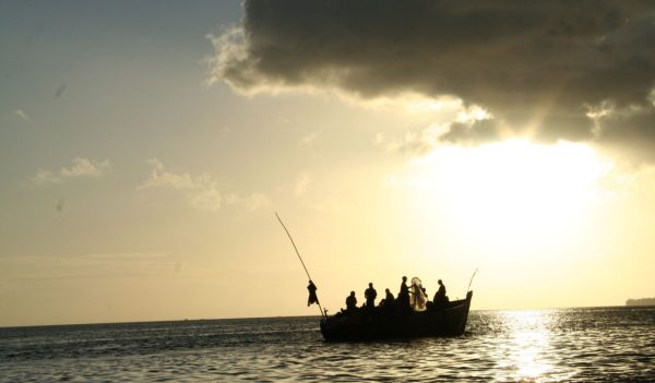 silhouet picture of boat on ocean africa