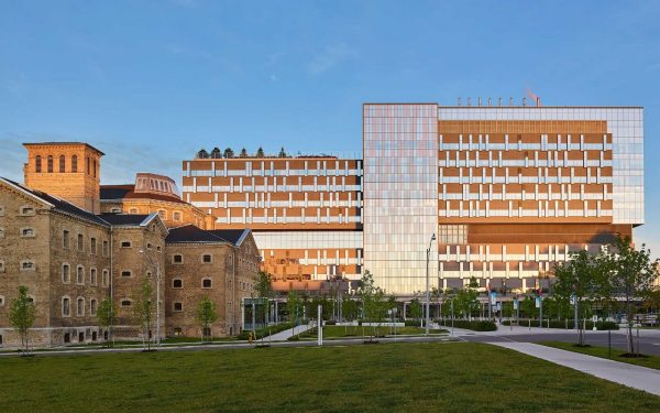 View of main entry of hospital with civic forecourt and historic Don Jail.