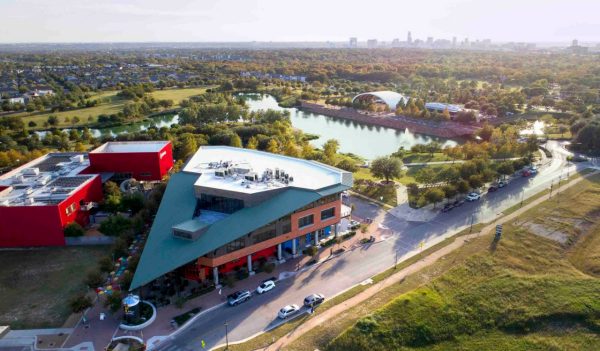 Aerial view of the redeveloped site with buildings and lake area