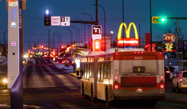 A bus on a street at night, Architectural Photographer Calgary