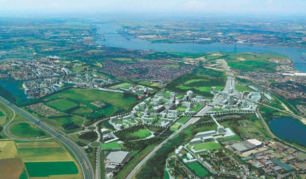 Aerial view of the city with green areas and a river