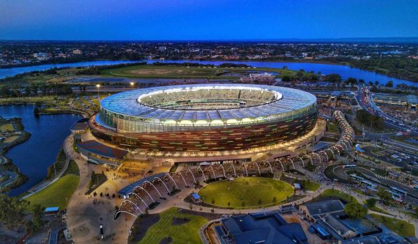 Aerial view of the stadium and surrounding site lit up at night