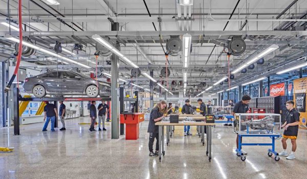 Automotive shop with students working on cars