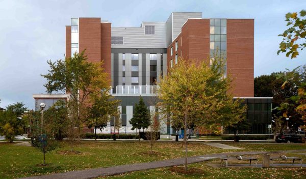 Exterior building with plantings and walkway in Fall