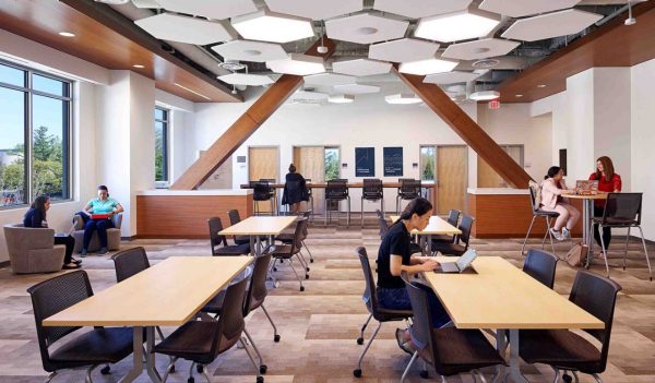 Students studying in a common area at tables