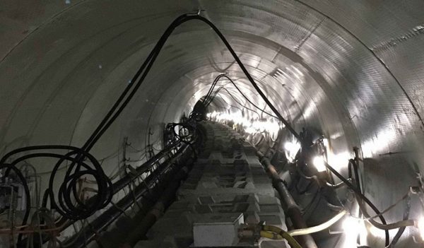 Tunnel interior with utility lines installed.