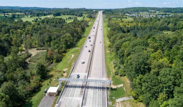 Aerial view of a highway with a toll station