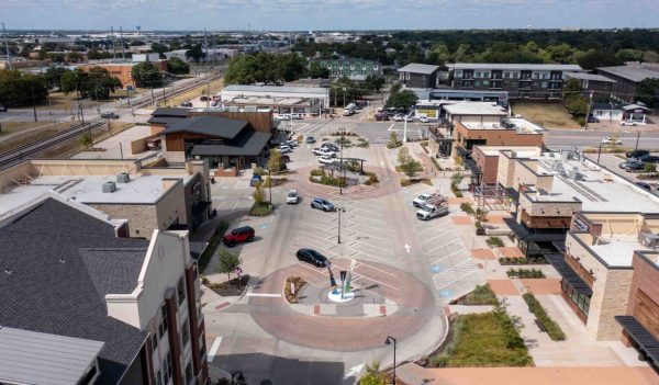 Rendering of street with parking and buildings