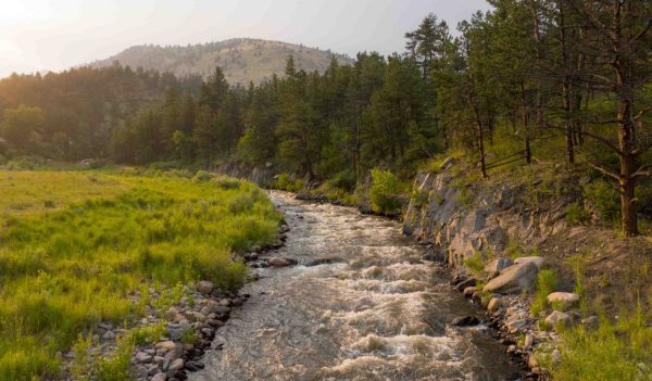 River running with mountains in the background.