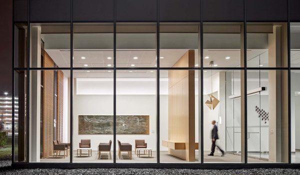 View into the lobby area of the cancer center from the outside through large widows.