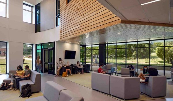 Interior common area with large windows and seating. 