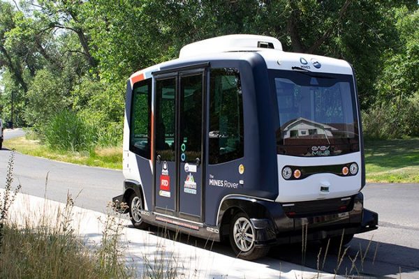 An AV vehicle parked on a road