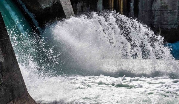 Water rushing through a dam