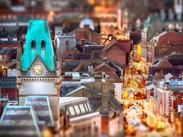 Winchester city view at night with Christmas market stalls in the high street