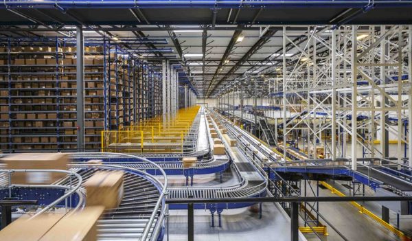 A large warehouse with packages moving along the conveyer system