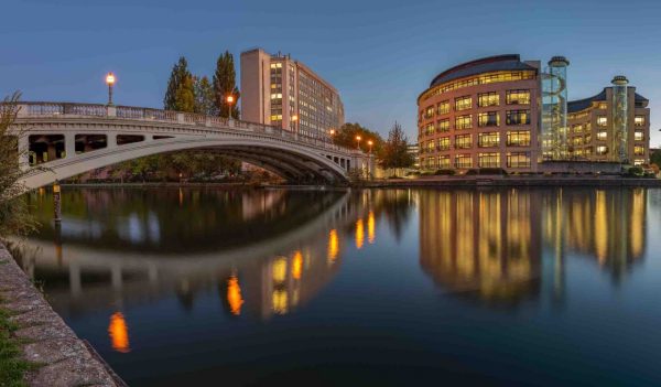 Road bridge over the River Thames surrounded by buildings